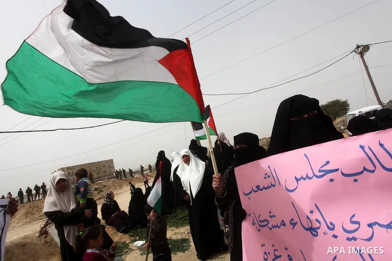 Palestinian women take part in a Hamas rally calling on Egyptian authorities to provide the Gaza Strip with electricity and fuel near the Rafah Border crossing, in the southern Gaza Strip, 20 March 2012. Gazans are repor...