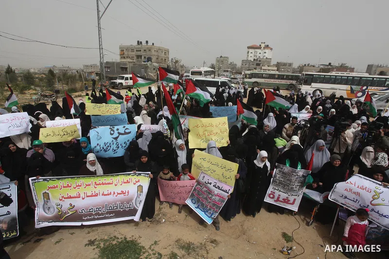 Palestinian women take part in a Hamas rally calling on Egyptian authorities to provide the Gaza Strip with electricity and fuel near the Rafah Border crossing, in the southern Gaza Strip, 20 March 2012. Gazans are repor...