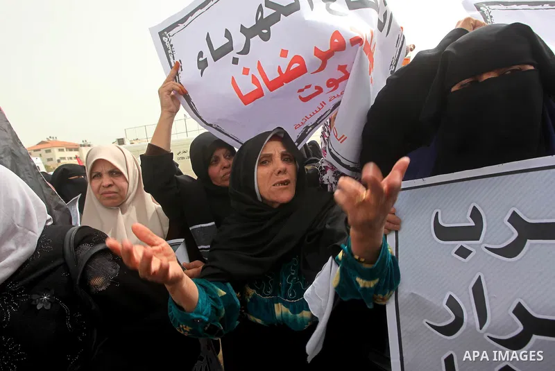 Palestinian women take part in a Hamas rally calling on Egyptian authorities to provide the Gaza Strip with electricity and fuel near the Rafah Border crossing, in the southern Gaza Strip, 20 March 2012. Gazans are repor...