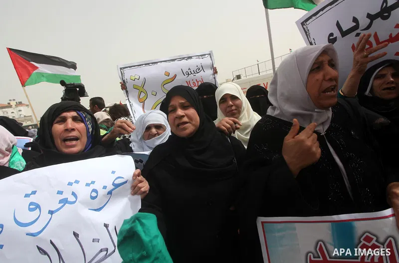 Palestinian women take part in a Hamas rally calling on Egyptian authorities to provide the Gaza Strip with electricity and fuel near the Rafah Border crossing, in the southern Gaza Strip, 20 March 2012. Gazans are repor...