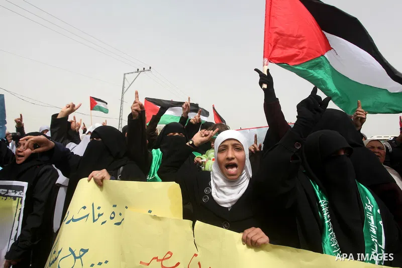 Palestinian women take part in a Hamas rally calling on Egyptian authorities to provide the Gaza Strip with electricity and fuel near the Rafah Border crossing, in the southern Gaza Strip, 20 March 2012. Gazans are repor...