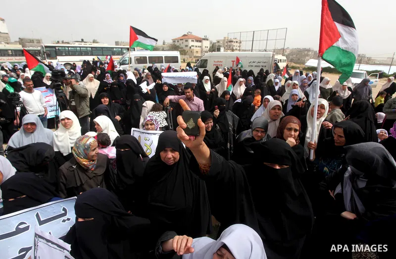 Palestinian women take part in a Hamas rally calling on Egyptian authorities to provide the Gaza Strip with electricity and fuel near the Rafah Border crossing, in the southern Gaza Strip, 20 March 2012. Gazans are repor...