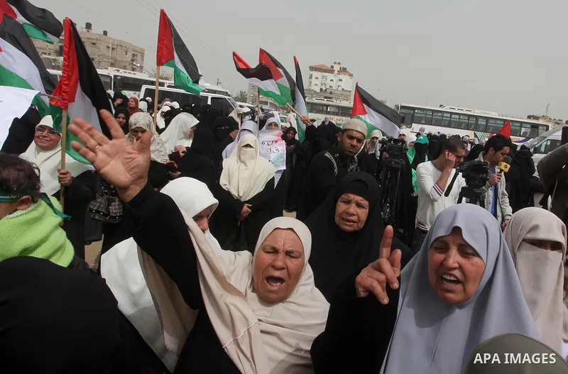 Palestinian women take part in a Hamas rally calling on Egyptian authorities to provide the Gaza Strip with electricity and fuel near the Rafah Border crossing, in the southern Gaza Strip, 20 March 2012. Gazans are repor...