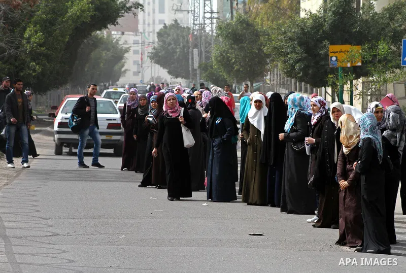 palestinians students wait a taxis in the street after the fuel shortage in Gaza Strip on 20 march 2012. Gaza's top political leader blamed Egypt earlier this month for causing a power crisis that has triggered lengthy b...