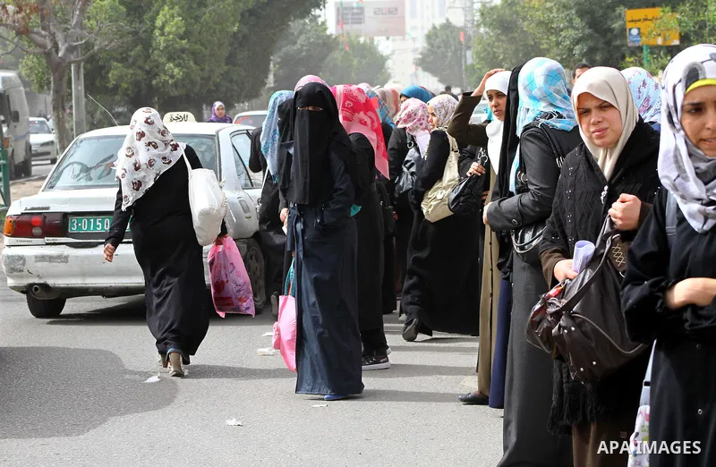 palestinians students wait a taxis in the street after the fuel shortage in Gaza Strip on 20 march 2012. Gaza's top political leader blamed Egypt earlier this month for causing a power crisis that has triggered lengthy b...