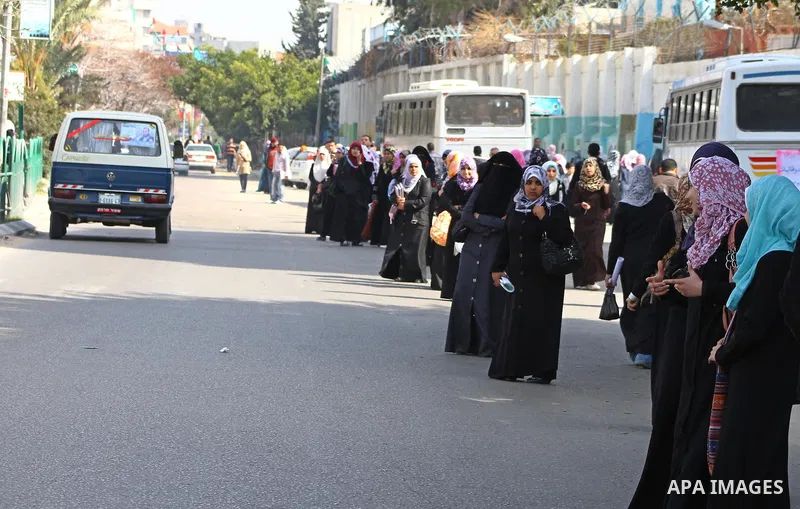palestinians students wait a taxis in the street after the fuel shortage in Gaza Strip on 21 march 2012. Gaza's top political leader blamed Egypt earlier this month for causing a power crisis that has triggered lengthy b...