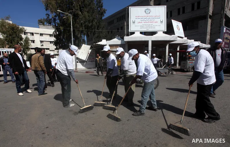 Palestinian volunteers clean the streets during the campaign "Cleanliness" in Gaza City on Mar. 22, 2012. Photo by Ashraf Amra