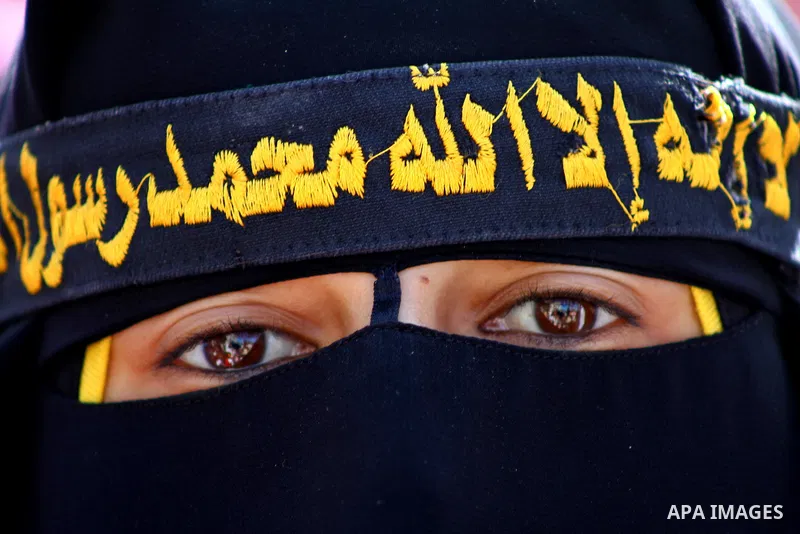 Palestinian women hold portraits of jailed compatriot Hana Shalabi, a female Palestinian prisoner jailed in Israel who has been on hunger strike for 37 days, outside the Red Cross building in Gaza City on Mar. 22, 2012....