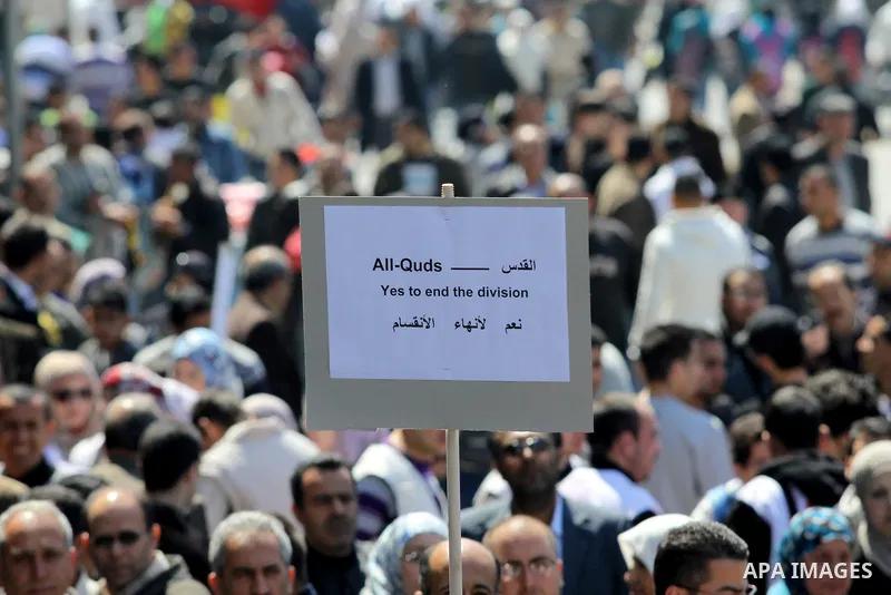 Demonstrators from the Palestinian factions participating in demonstration to end the division and are demanding a national unity in the West Bank city of Nablus, Mar. 22, 2012 .Photo by Nedal Shtieh.