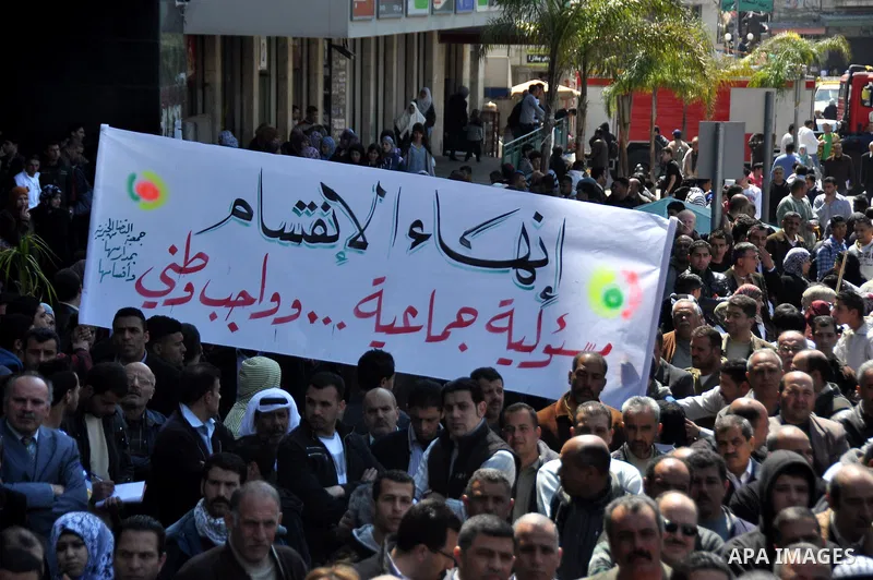 Demonstrators from the Palestinian factions participating in demonstration to end the division and are demanding a national unity in the West Bank city of Nablus, Mar. 22, 2012 .Photo by Nedal Shtieh.