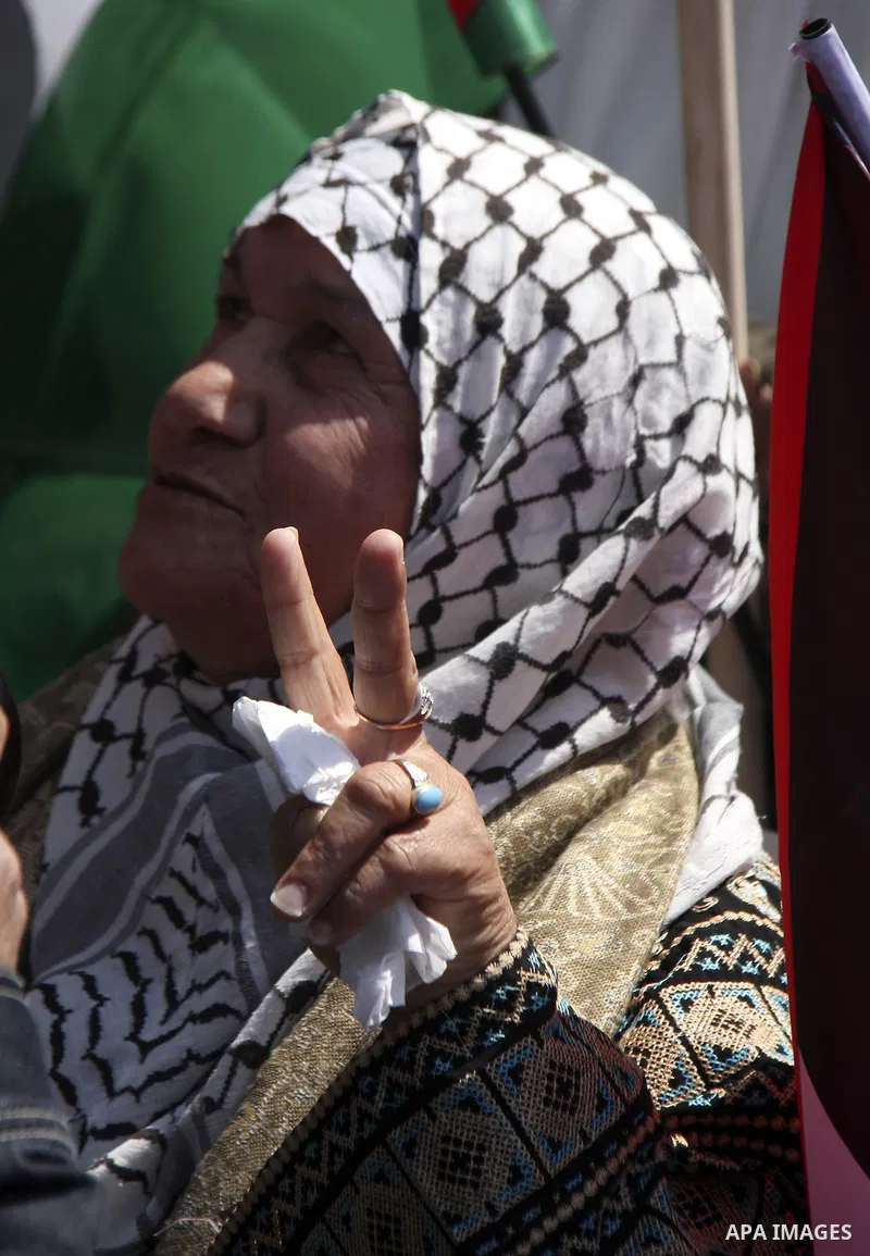 Demonstrators from the Palestinian factions participating in demonstration to end the division and are demanding a national unity in the West Bank city of Nablus, Mar. 22, 2012 .Photo by Wagdi Eshtayah