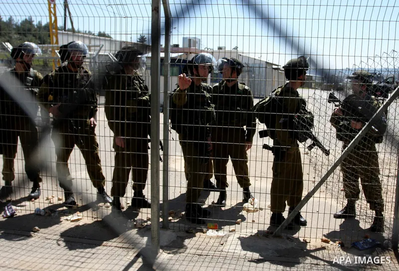 Palestinian demonstrators during a protest supporting Palestinian prisoner Hana Shalabi, outside Ofer prison near the West Bank city of Ramallah March 22, 2012. The deteriorating health of Shalabi, the Palestinian prison...