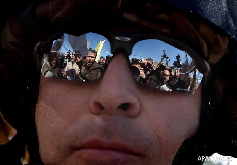 Palestinian demonstrators during a protest supporting Palestinian prisoner Hana Shalabi, outside Ofer prison near the West Bank city of Ramallah March 22, 2012. The deteriorating health of Shalabi, the Palestinian prison...