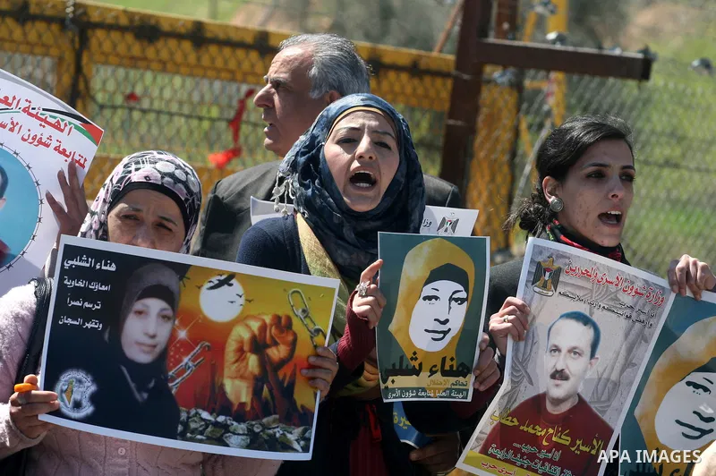 Palestinian demonstrators during a protest supporting Palestinian prisoner Hana Shalabi, outside Ofer prison near the West Bank city of Ramallah March 22, 2012. The deteriorating health of Shalabi, the Palestinian prison...