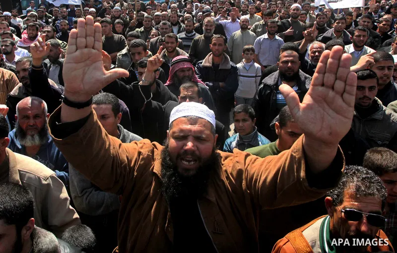 Palestinians take part in a rally calling on Egyptian authorities to supply the Gaza Strip with fuel and electricity in Khan Younis on the southern Gaza Strip March 23, 2012. Israel allowed nine fuel tankers to cross int...