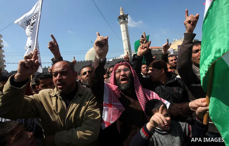 Palestinians take part in a rally calling on Egyptian authorities to supply the Gaza Strip with fuel and electricity in Khan Younis on the southern Gaza Strip March 23, 2012. Israel allowed nine fuel tankers to cross int...