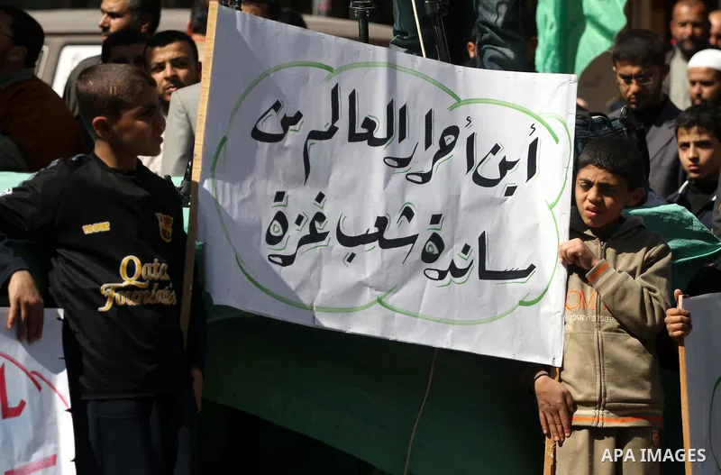 Palestinians take part in a rally calling on Egyptian authorities to supply the Gaza Strip with fuel and electricity in Gaza City March 23, 2012. Israel allowed nine fuel tankers to cross into the Gaza Strip on Friday to...