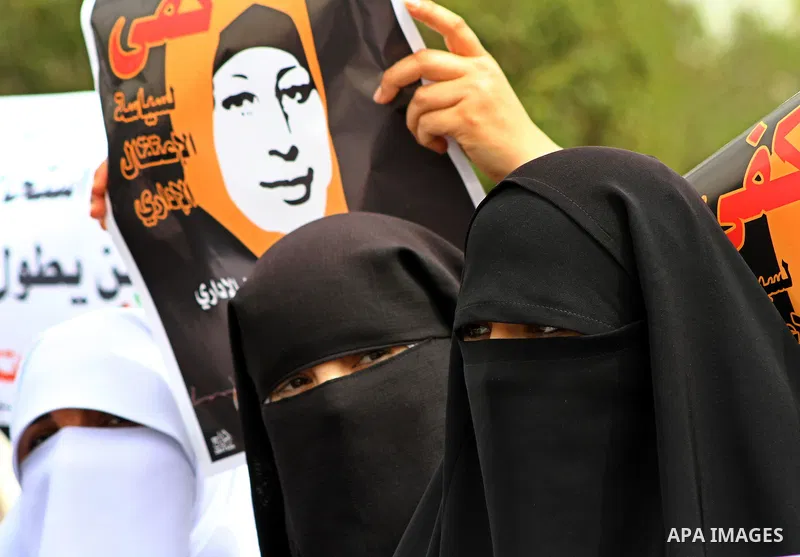 A Palestinian Hamas muslim women next to a poster of Hana Shalaby during a rally at the Palestinian Parliament in Gaza City on, 25 March 2012. Reports state that Hanna Shalabe a Palestinian prisoner in an Israel prison h...