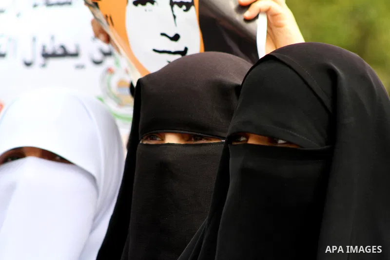 A Palestinian Hamas muslim women next to a poster of Hana Shalaby during a rally at the Palestinian Parliament in Gaza City on, 25 March 2012. Reports state that Hanna Shalabe a Palestinian prisoner in an Israel prison h...