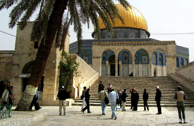 Jewish settler look to the dome of the rock at Al-Aqsa mosque in the old city of Jerusalem on March. 25, 2012. Photo by Mahfouz Abu Turk