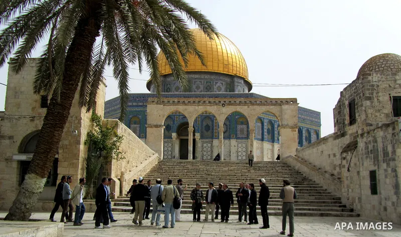 Jewish settler look to the dome of the rock at Al-Aqsa mosque in the old city of Jerusalem on March. 25, 2012. Photo by Mahfouz Abu Turk