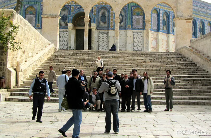 Jewish settler look to the dome of the rock at Al-Aqsa mosque in the old city of Jerusalem on March. 25, 2012. Photo by Mahfouz Abu Turk