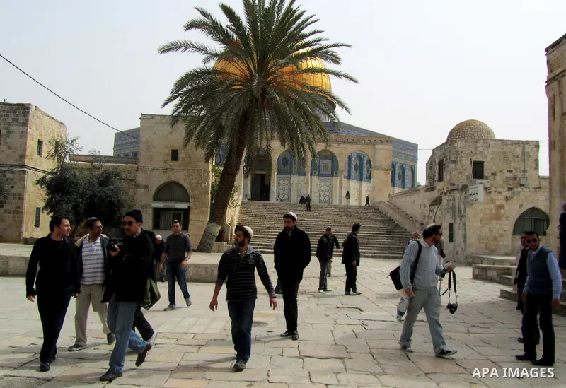 Jewish settler look to the dome of the rock at Al-Aqsa mosque in the old city of Jerusalem on March. 25, 2012. Photo by Mahfouz Abu Turk