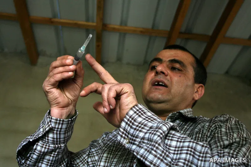 A Palestinian Radi Osman, work at a mushroom plantation production in West Bank city of Ramallah, on March 24, 2012. Photo by Issam Rimawi