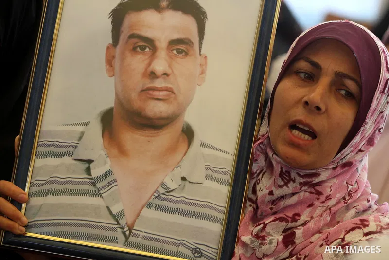 Palestinians gather during a protest at the Red Cross' offices in Gaza City to call for the release of Palestinian prisoners held in Israeli jails, on March 26, 2012. Photo by Mohammed Asad