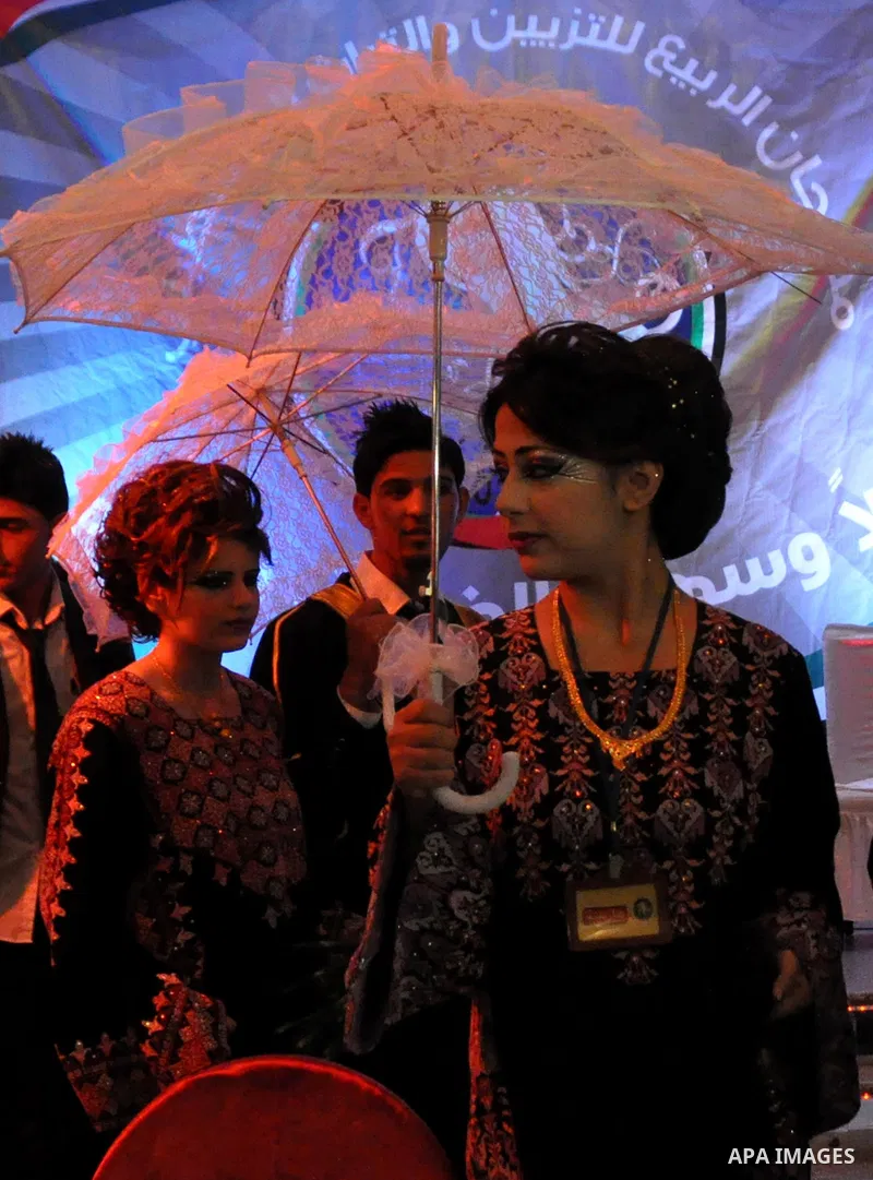 Palestinian models line up on stage during a beauty pageant and hair styling contest in the West Bank city of Tulkarem, Monday, March 26, 2012. Over 100 Palestinians, Israeli Arabs and Golan residents took part in the pa...