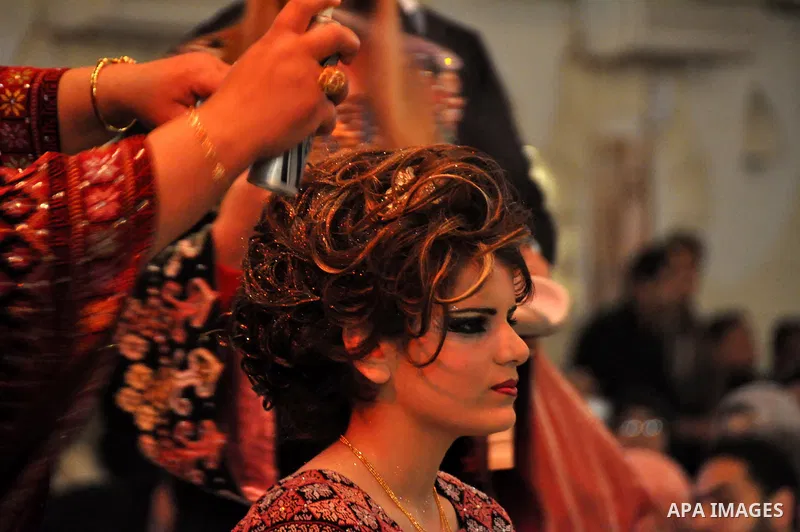Palestinian models line up on stage during a beauty pageant and hair styling contest in the West Bank city of Tulkarem, Monday, March 26, 2012. Over 100 Palestinians, Israeli Arabs and Golan residents took part in the pa...
