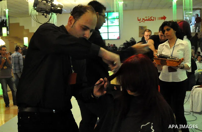 Israeli Arab models line up on stage during a beauty pageant and hair styling contest in the West Bank city of Tulkarem, Monday, March 26, 2012. Over 100 Palestinians, Israeli Arabs and Golan residents took part in the p...