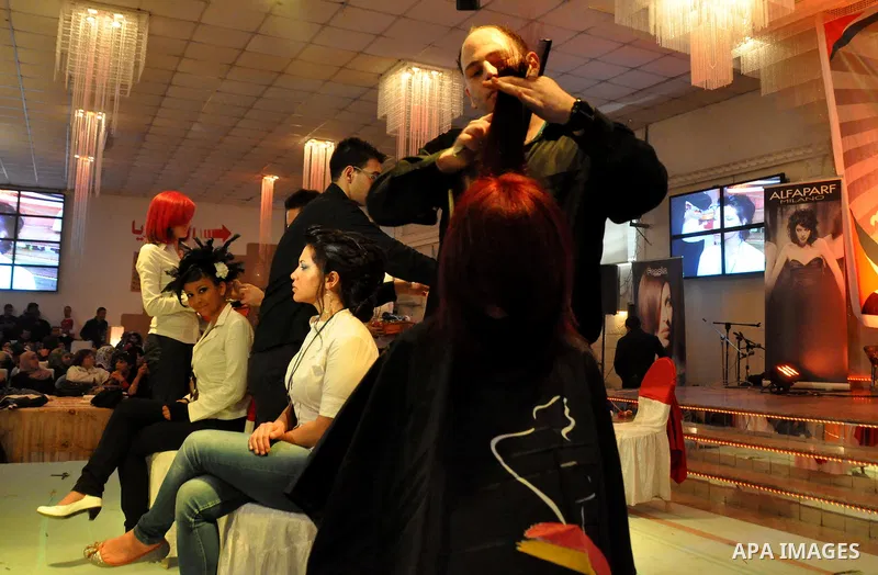 Israeli Arab models line up on stage during a beauty pageant and hair styling contest in the West Bank city of Tulkarem, Monday, March 26, 2012. Over 100 Palestinians, Israeli Arabs and Golan residents took part in the p...