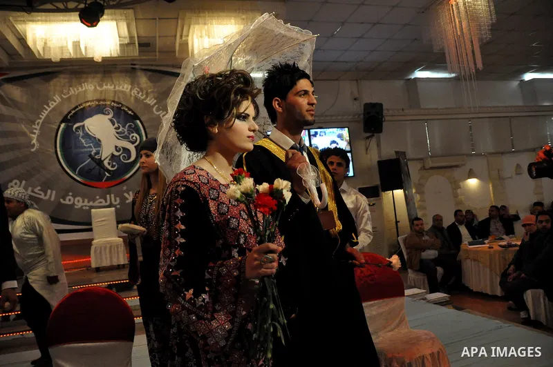 Palestinian models line up on stage during a beauty pageant and hair styling contest in the West Bank city of Tulkarem, Monday, March 26, 2012. Over 100 Palestinians, Israeli Arabs and Golan residents took part in the pa...