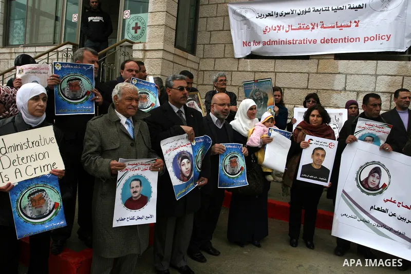 Palestinians hold portraits of Islamic Jihad supporter Hana Shalabi, a female Palestinian prisoner jailed in Israel who has been on hunger strike for 35 days, during a rally in solidarity with Palestinian prisoners in Is...