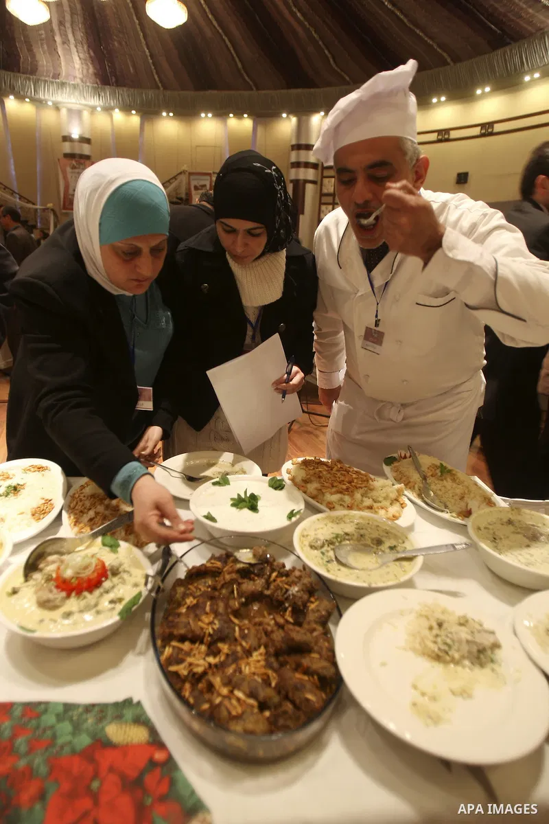 Palestinians take part during festival for the best cook in West Bank city of Nablus Tuesday, March 27, 2012. Photo by Wagdi Eshtayah