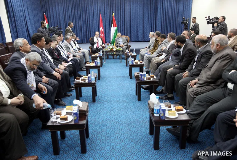 Palestinian Foreign Affairs Minister in Gaza Strip, Mohammed Awad receives President of the Teka Institution in Gaza City on Mar. 27,2012. Photo by Ahmed Shaat