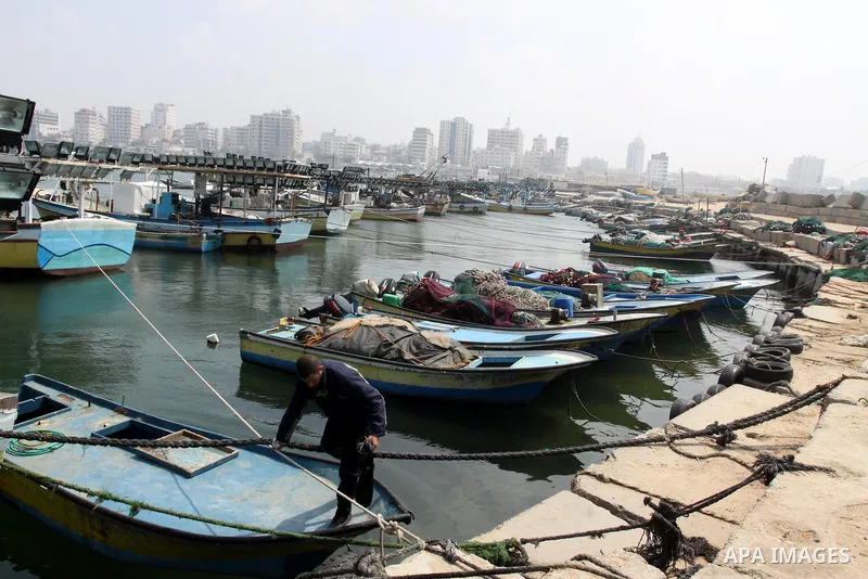 Palestinian fishermen stop for work in Gaza city on March 28, 2012, after his boat stopped working due to lack of fuel. Gaza is experiencing a major electricity crisis because of a shortage of fuel for the power plant. P...
