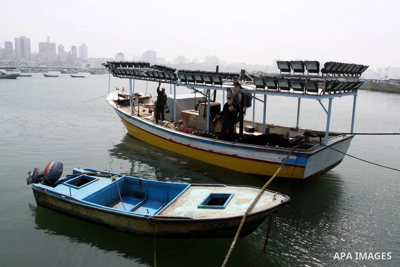 Palestinian fishermen stop for work in Gaza city on March 28, 2012, after his boat stopped working due to lack of fuel. Gaza is experiencing a major electricity crisis because of a shortage of fuel for the power plant. P...