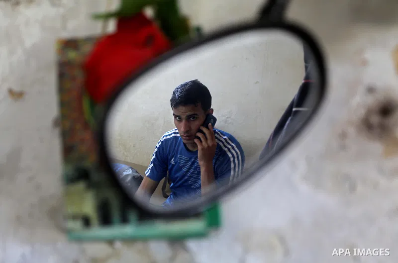 Palestinian runner Bahaa al-Farra, who has been selected to represent Palestine at the London Olympics in July - August 2012 during a break at his house in Gaza City on March 29, 2012. Farra will be one of a four-strong...