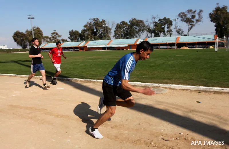 Palestinian runner Bahaa al-Farra, who has been selected to represent Palestine at the London Olympics in July - August 2012 during training at the al-Yarmouk soccer stadium in Gaza City on March 29, 2012. Farra will be...
