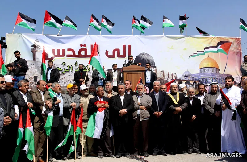 Palestinian factions leaders take part in a protest marking Land Day, near the border between Israel and the northern Gaza Strip March 30, 2012. Israeli security forces fired rubber bullets, tear gas and stun grenades to...