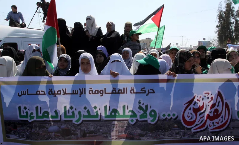 Palestinian protesters take part in a protest marking Land Day, near the border between Israel and the northern Gaza Strip March 30, 2012. Israeli security forces fired rubber bullets, tear gas and stun grenades to break...