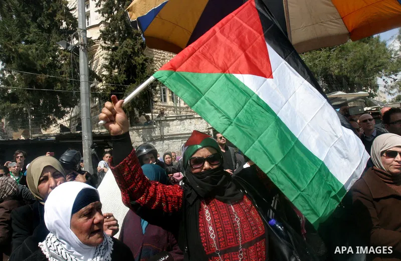 Palestinian protesters take part in a demonstration on Land Day outside Damascus Gate in Jerusalem's Old City March 30, 2012. Israeli security forces fired rubber bullets, tear gas and stun grenades to break up groups of...