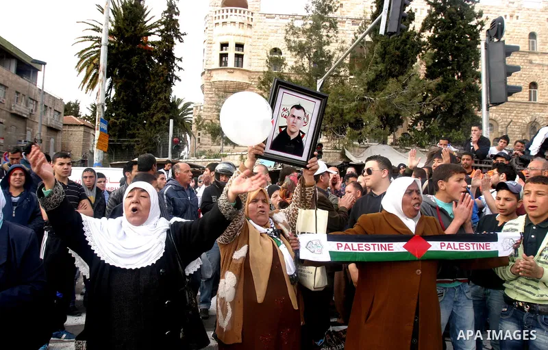 Palestinian protesters take part in a demonstration on Land Day outside Damascus Gate in Jerusalem's Old City March 30, 2012. Israeli security forces fired rubber bullets, tear gas and stun grenades to break up groups of...
