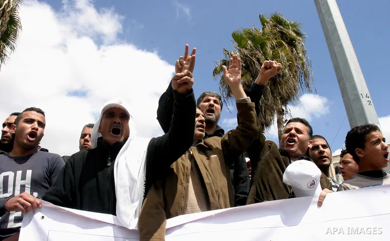 Palestinian protesters take part in a demonstration on Land Day outside Damascus Gate in Jerusalem's Old City March 30, 2012. Israeli security forces fired rubber bullets, tear gas and stun grenades to break up groups of...