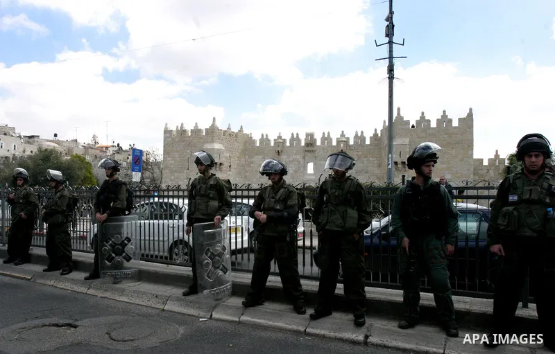 Israeli security officers stand guard before Friday prayers on Land Day outside Damascus Gate in Jerusalem's Old City March 30, 2012. Israeli security forces fired rubber bullets, tear gas and stun grenades to break up g...
