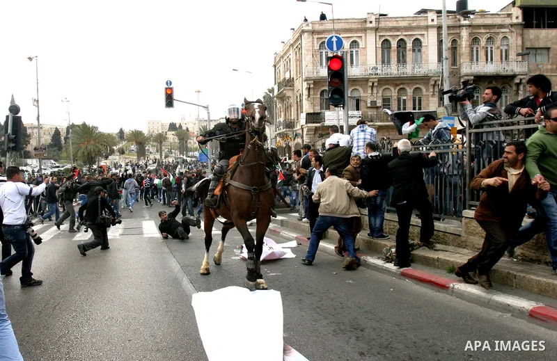 Israeli police officers on horseback scuffle with Palestinians during clashes on Land Day after Friday prayers outside Damascus Gate in Jerusalem's Old City March 30, 2012. Israeli security forces fired rubber bullets, t...
