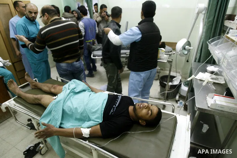 A wounded Palestinian receives medical care at a hospital in Khan Yunis, after being injured during protests on Land Day close to the border with Israel in the eastern Gaza Strip Friday, March 30, 2012. Israeli security...