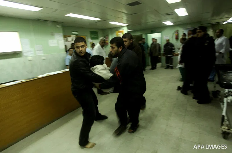 A wounded Palestinian receives medical care at a hospital in northern Gaza Strip, after being injured during protests on Land Day close to the border with Israel in the northern Gaza Strip Friday, March 30, 2012. Israeli...
